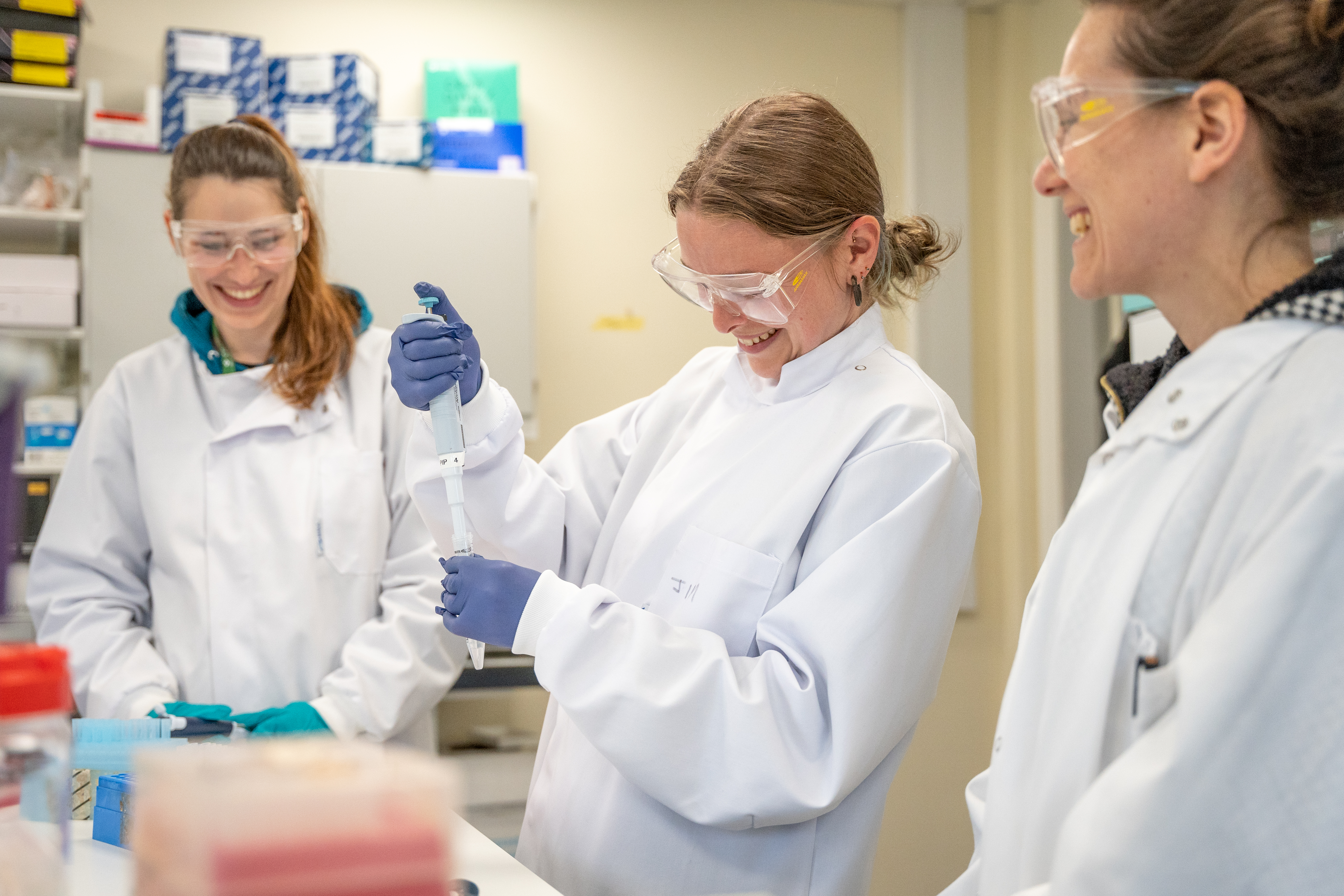 Students using pipettes in a laboratory