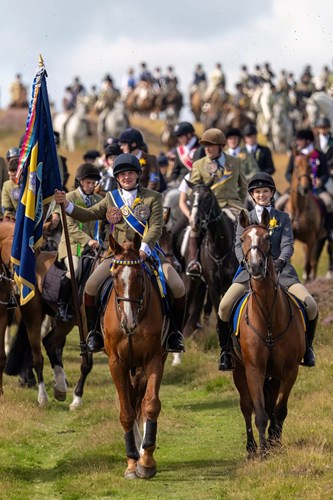 A huge amount of people riding horses