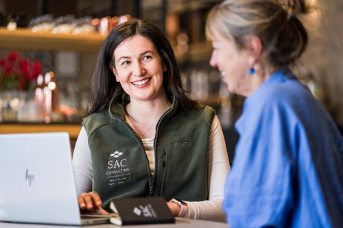 Two women looking at laptop