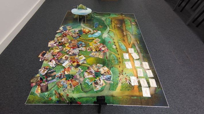 A board with cards and instructions like in a style of a game